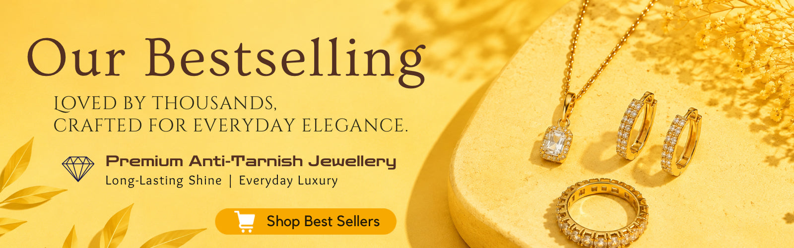 Promotional banner for premium anti-tarnish jewellery, featuring a necklace, hoop earrings, and ring displayed on a gold-toned surface with decorative text and a 'Shop Best Sellers' button.